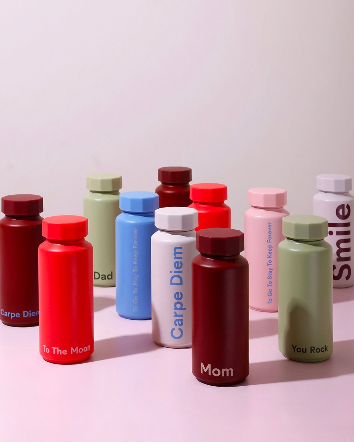 Bottiglia termica di design con scritta "Carpe Diem" in acciaio