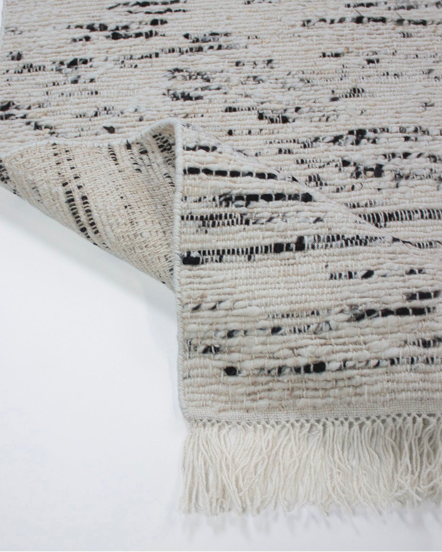 Tappeto in lana con frange Ellsa