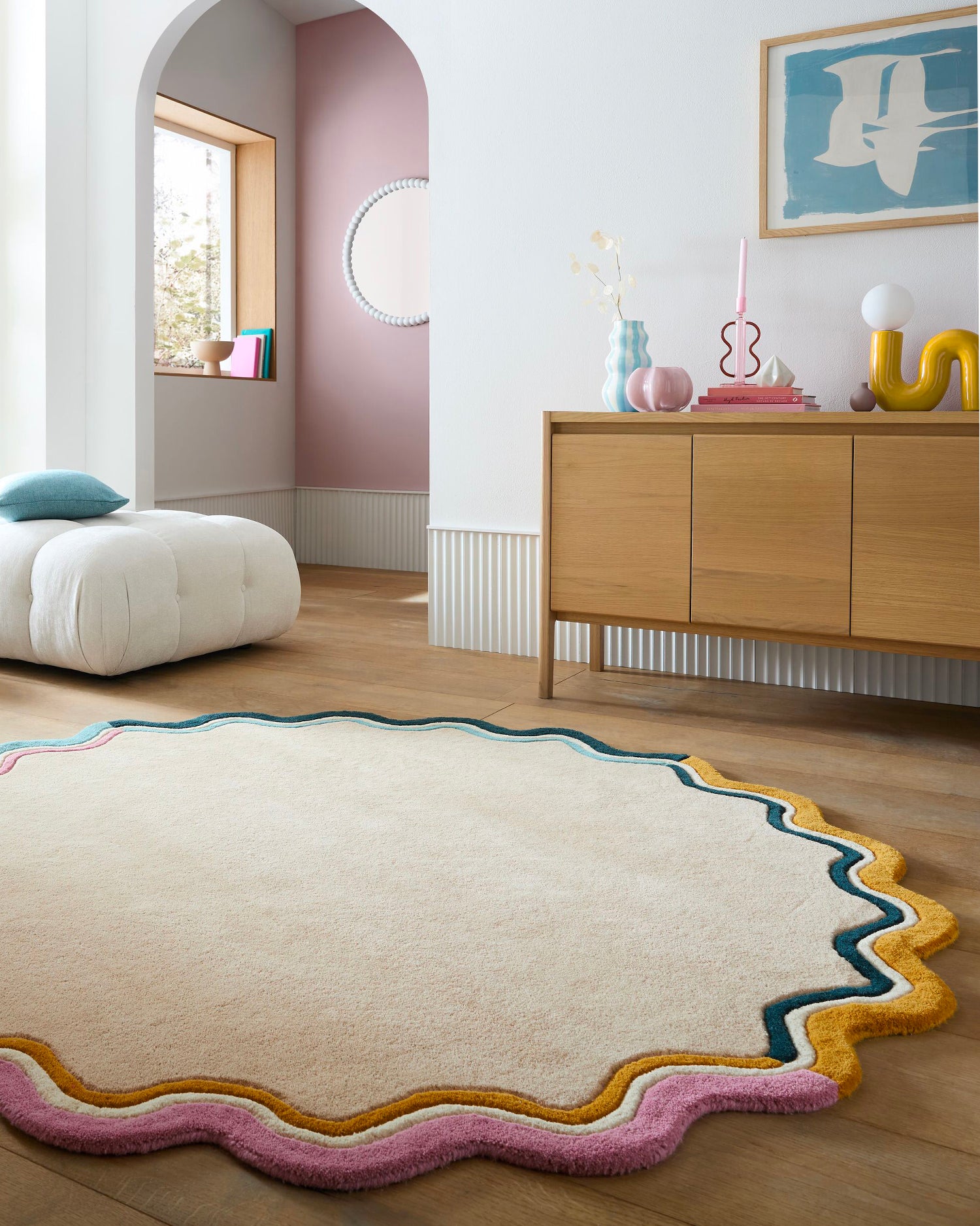 Tappeto rotondo in lana con bordo smerlato Leo