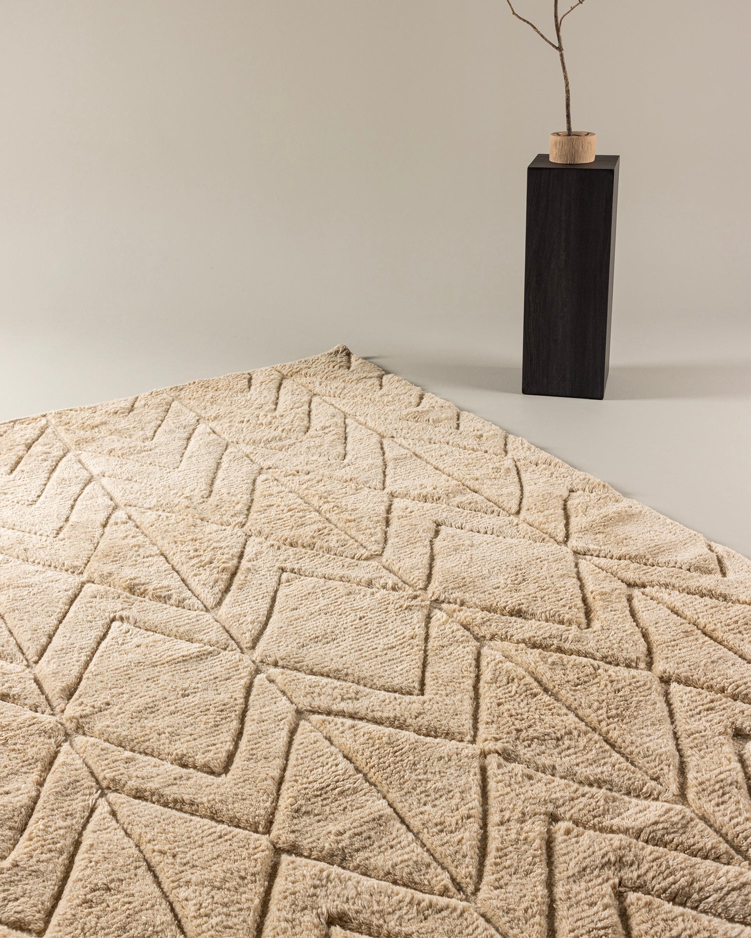 Tappeto in lana con motivo intrecciato Zoe