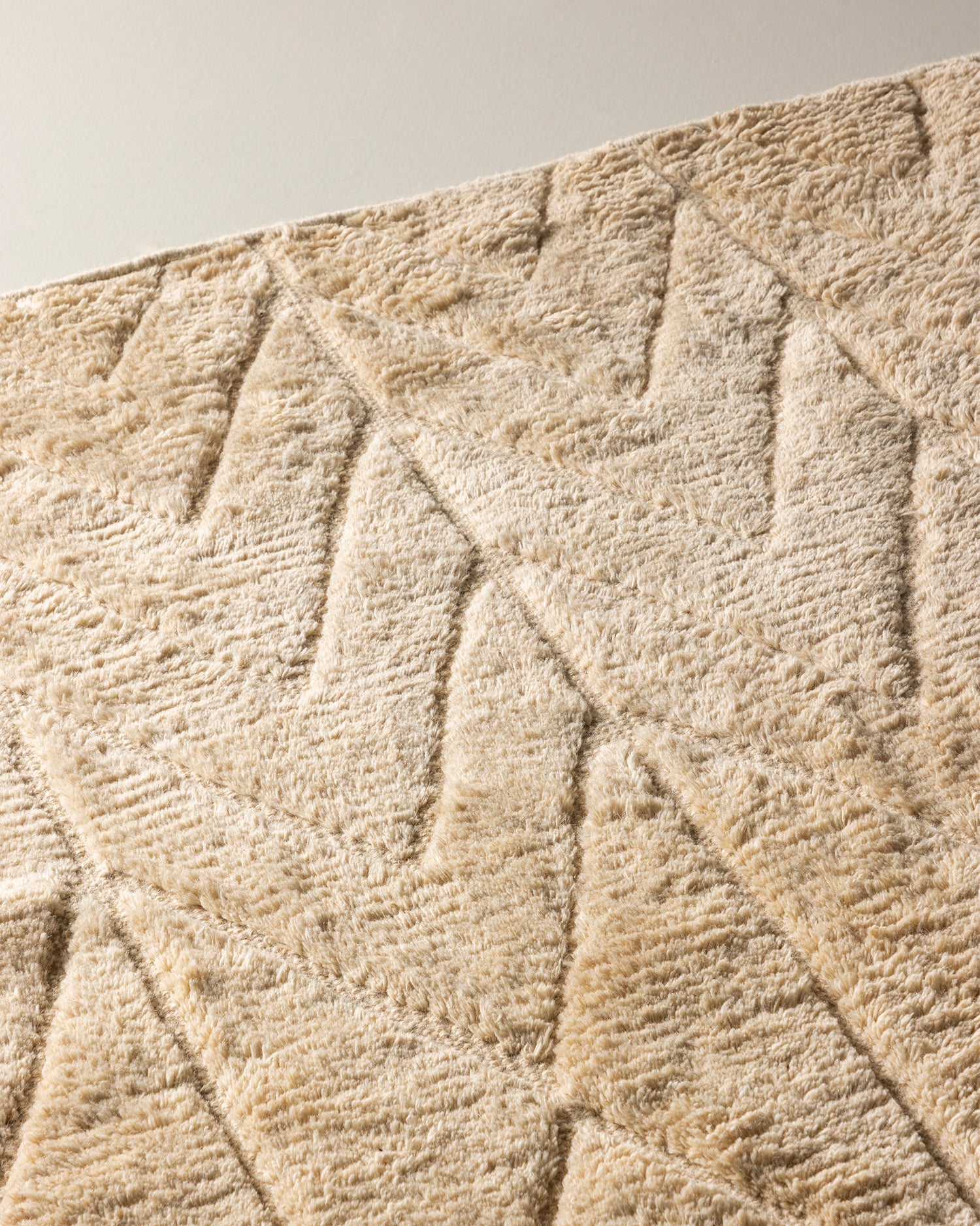 Tappeto in lana con motivo intrecciato Zoe